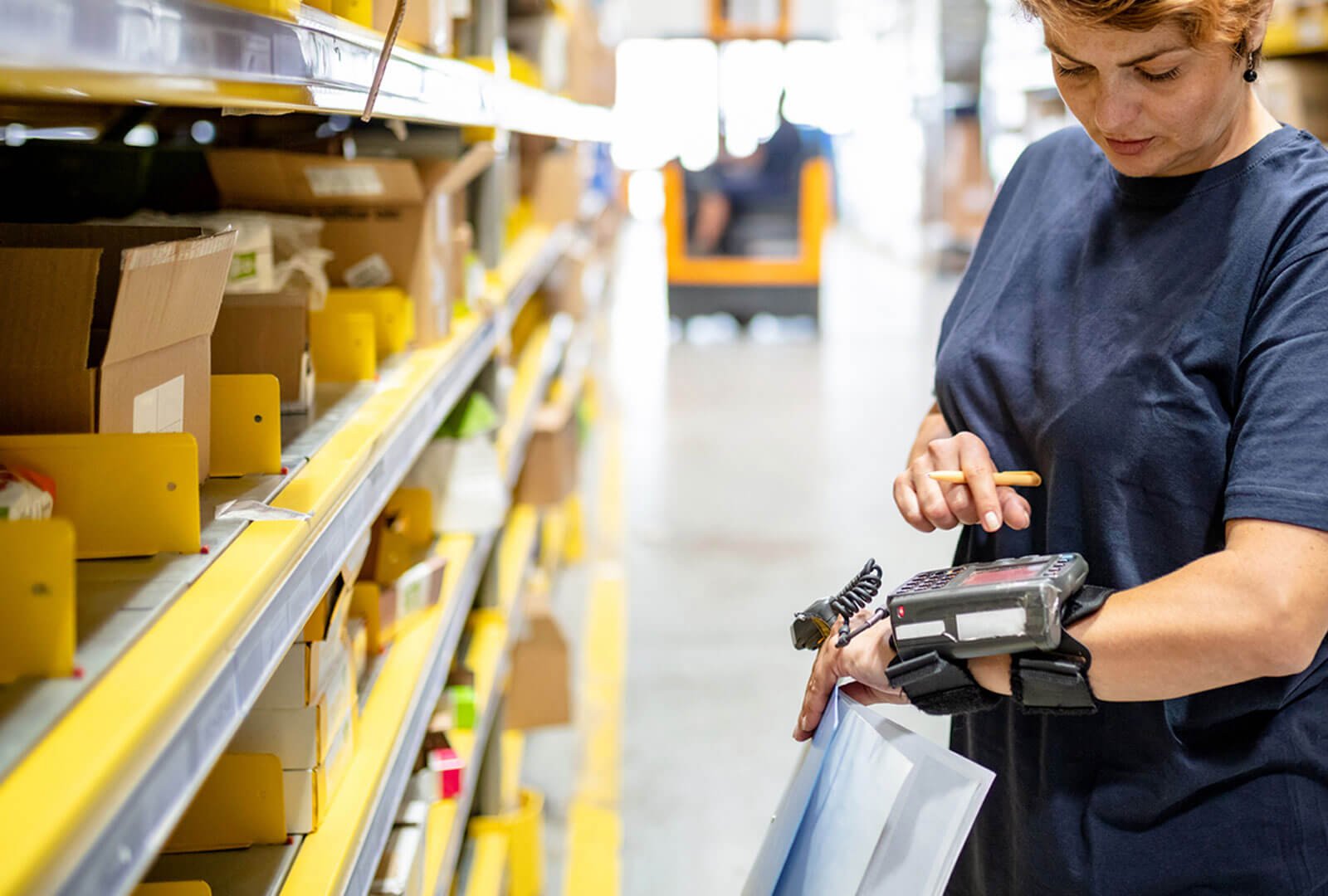 warehouse worker looking at a device