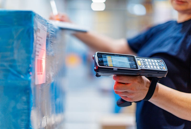 Worker scanning a barcode